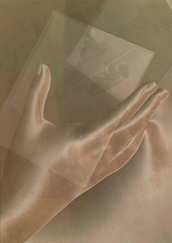 Maurice Tabard. ETUDE (DOUBLE EXPOSURE OF HAND AND BUGATTI) 1930. Via sothebys