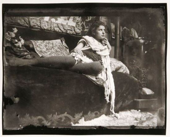 Alphonse Marie Mucha. Model reclining on the couch in Mucha's studio rue du Val de Grâce 1899 Via muchafoundation