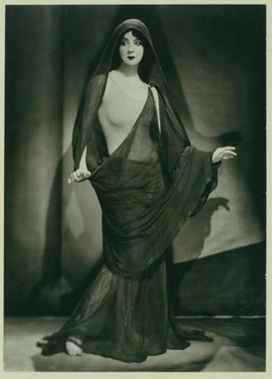 Nickolas Muray.Ruth St. Denis, long fabric draped around one shoulder and over her head. (ca. 1923) Via nypl