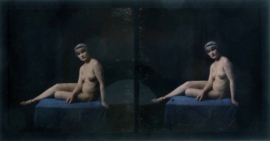 A Lumière utochrome tereo ude ortrait Study, girl sitting on blue cloth-covered table, with silver-coloured ornament in hair and wearing gold sandals