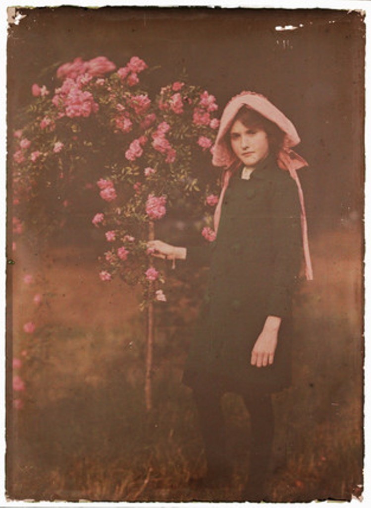 Etheldreda Janet Laing. young girl standing in a garden 1910. Autochrome ® National media museum