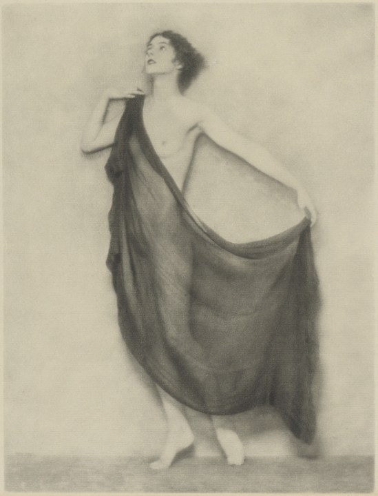 Arthur F. Kales. Draped Female Nude Standing Against a Bare Background 1920. Via getty