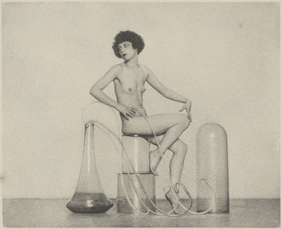 [Female Nude Posed With Glass Jars]