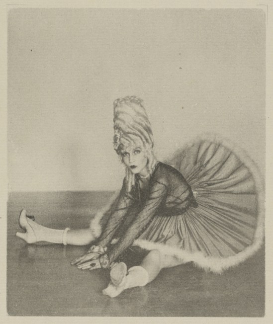 Arthur F. Kales. Woman in Can Can Costume Seated on Floor with Legs Spread Apart 1920. Via getty