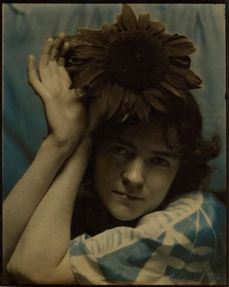 Edward Steichen. Dana Steichen Holdind sunflower to head 1920. Via eastman museum